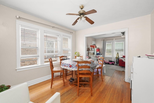 4624 W Montana St, Chicago, IL 60639 - dining room featuring ceiling fan and light wood finished floors