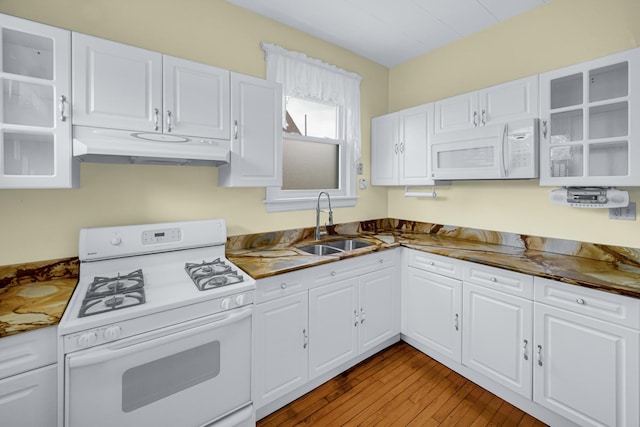 5736 S Honore St, Chicago, IL 60636 - kitchen with white appliances, under cabinet range hood, white cabinets, hardwood / wood-style floors, and glass insert cabinets