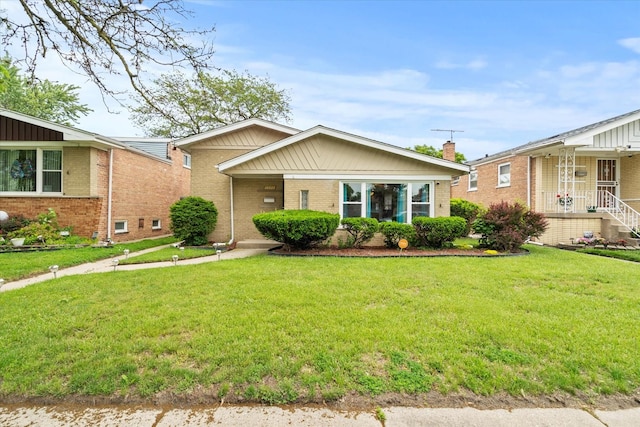 14427 Kenwood Ave, Dolton, IL 60419 - view of front of home featuring brick siding and a front yard