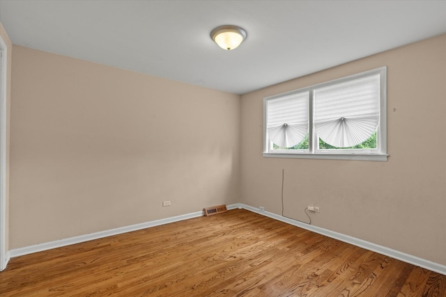 14427 Kenwood Ave, Dolton, IL 60419 - spare room featuring light wood-style flooring and baseboards