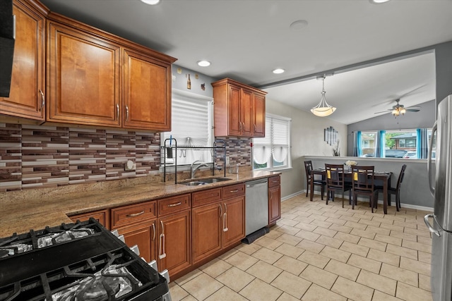 14427 Kenwood Ave, Dolton, IL 60419 - kitchen featuring stainless steel appliances, brown cabinets, backsplash, a ceiling fan, and recessed lighting