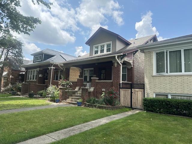 6735 Riverside Dr, Berwyn, IL 60402 - bungalow-style house featuring a front yard, brick siding, and a porch