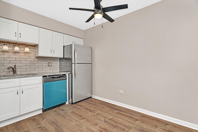 2237 175th St Unit 1B, Lansing, IL 60438 - kitchen featuring dishwashing machine, freestanding refrigerator, decorative backsplash, and light wood-style floors