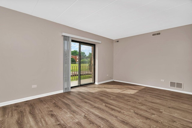 2237 175th St Unit 1B, Lansing, IL 60438 - spare room featuring baseboards and wood finished floors