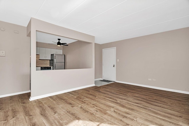 2237 175th St Unit 1B, Lansing, IL 60438 - unfurnished living room featuring ceiling fan and wood finished floors