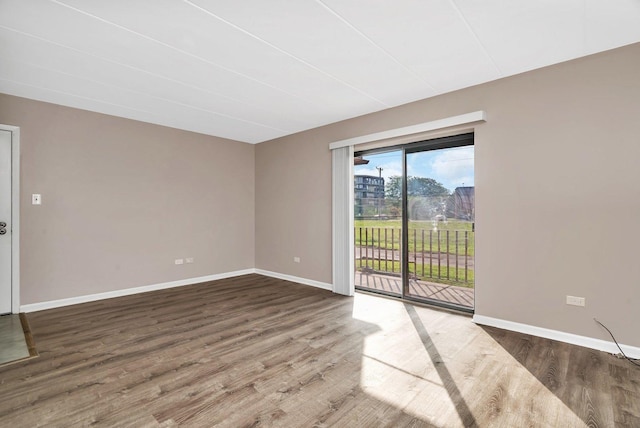 2237 175th St Unit 1B, Lansing, IL 60438 - spare room with wood finished floors and baseboards