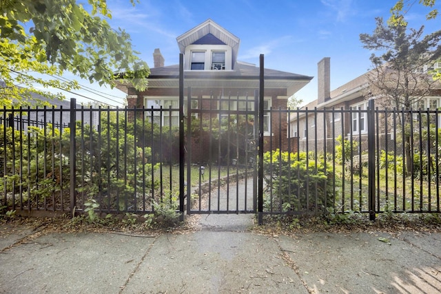 7515 S E End Ave, Chicago, IL 60649 - view of front of home featuring a fenced front yard, a gate, and brick siding
