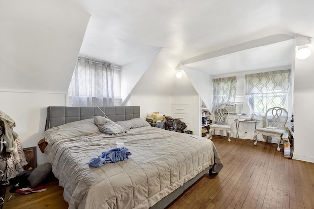 7515 S E End Ave, Chicago, IL 60649 - bedroom featuring vaulted ceiling, multiple windows, and hardwood / wood-style flooring