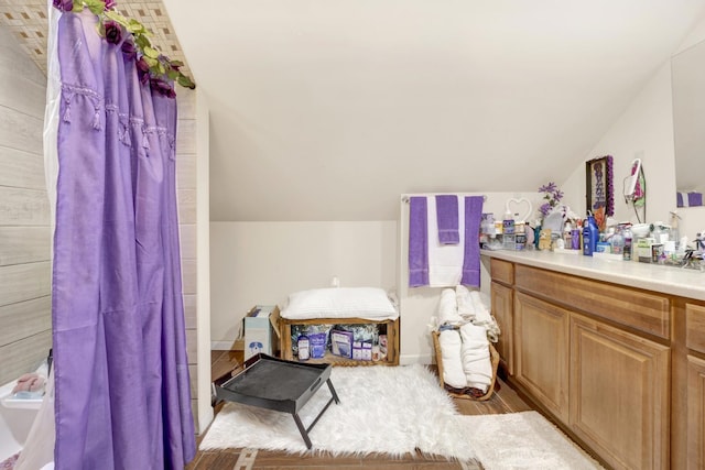 7515 S E End Ave, Chicago, IL 60649 - full bathroom featuring vaulted ceiling, vanity, wood finished floors, and a shower with curtain
