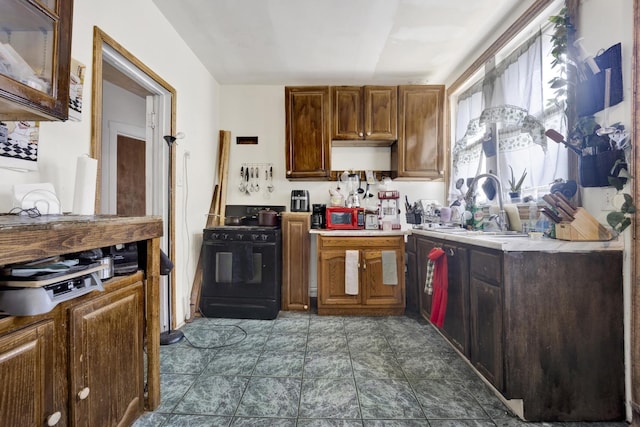 7515 S E End Ave, Chicago, IL 60649 - kitchen featuring black gas range oven and light countertops
