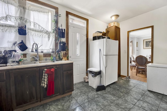 7515 S E End Ave, Chicago, IL 60649 - kitchen featuring freestanding refrigerator, light countertops, and dark tile patterned floors