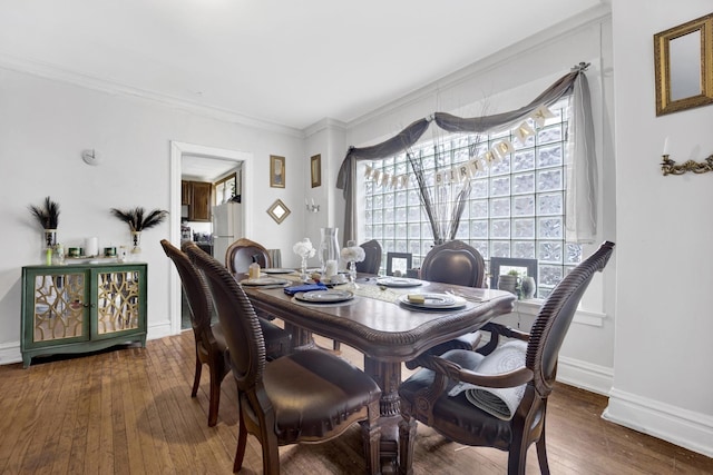7515 S E End Ave, Chicago, IL 60649 - dining space with healthy amount of natural light, ornamental molding, and hardwood / wood-style flooring