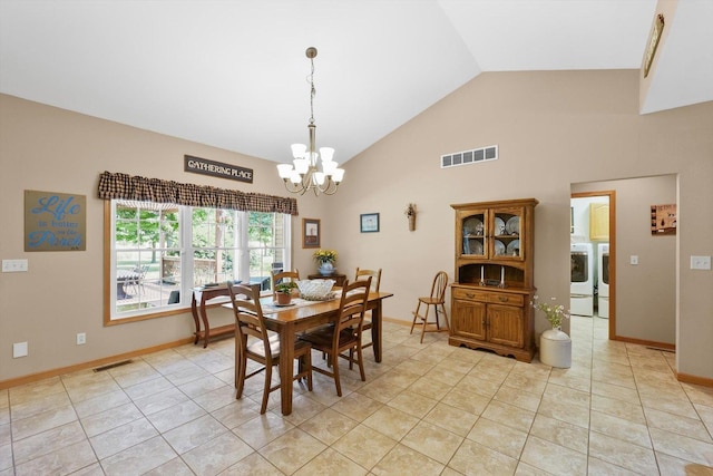2598B County Road 600 E, Dewey, IL 61840 - dining area with a chandelier, high vaulted ceiling, separate washer and dryer, and light tile patterned floors