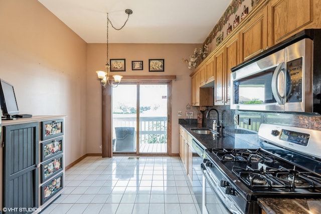 6713 181st St, Tinley Park, IL 60477 - kitchen featuring stainless steel appliances, brown cabinets, hanging light fixtures, light tile patterned floors, and dark stone counters