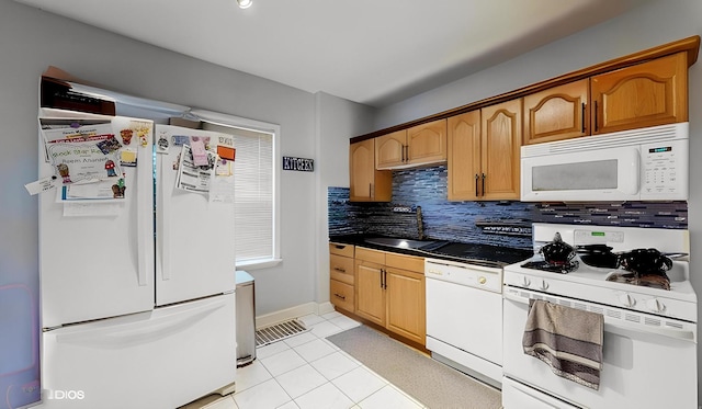 7318 W Archer Ave, Summit, IL 60501 - kitchen featuring white appliances, decorative backsplash, light tile patterned floors, and dark countertops