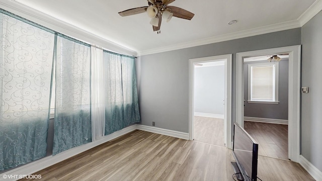 7318 W Archer Ave, Summit, IL 60501 - unfurnished bedroom with crown molding, wood finished floors, and ceiling fan