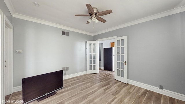 7318 W Archer Ave, Summit, IL 60501 - unfurnished room with french doors, wood finished floors, ornamental molding, and a ceiling fan