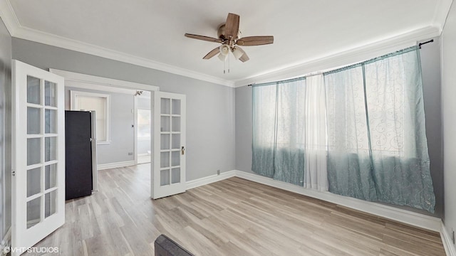 7318 W Archer Ave, Summit, IL 60501 - empty room featuring french doors, crown molding, healthy amount of natural light, wood finished floors, and ceiling fan