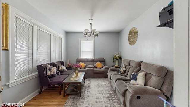 7318 W Archer Ave, Summit, IL 60501 - living room with a chandelier and light wood-style flooring