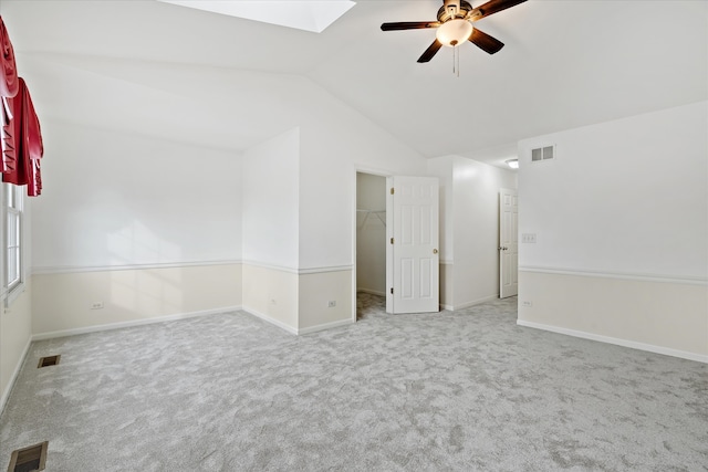 13261 Forest Ridge Dr Unit 0, Palos Heights, IL 60463 - unfurnished room with ceiling fan, lofted ceiling, carpet floors, and a skylight