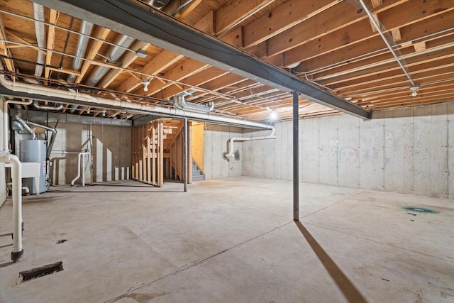 13261 Forest Ridge Dr Unit 0, Palos Heights, IL 60463 - unfinished below grade area featuring gas water heater and stairs