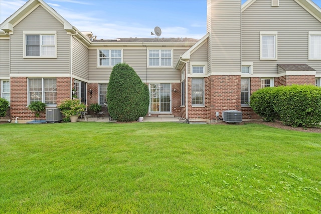13261 Forest Ridge Dr Unit 0, Palos Heights, IL 60463 - rear view of property featuring brick siding, a yard, and a chimney