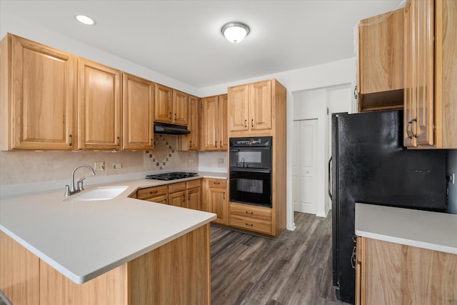 13261 Forest Ridge Dr Unit 0, Palos Heights, IL 60463 - kitchen with black appliances, light countertops, a peninsula, under cabinet range hood, and dark wood-type flooring