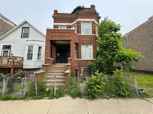 4038 W Adams St, Chicago, IL 60624 - view of front of home with a fenced front yard, brick siding, and a gate
