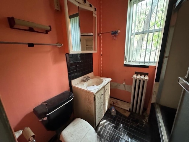 4038 W Adams St, Chicago, IL 60624 - full bathroom with radiator heating unit, a bath, and vanity
