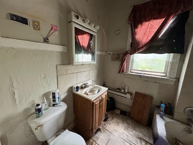 4038 W Adams St, Chicago, IL 60624 - bathroom with vanity, a tub to relax in, and plenty of natural light