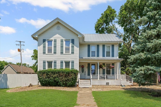 835 E Pells St, Paxton, IL 60957 - view of front of home with a porch, a metal roof, and a standing seam roof