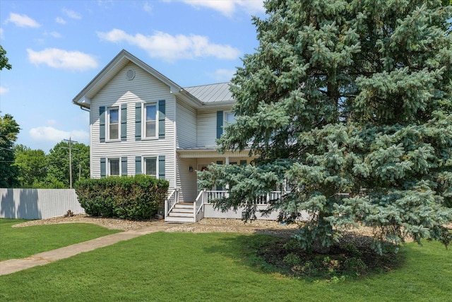 835 E Pells St, Paxton, IL 60957 - view of front of home featuring a porch, a metal roof, and a standing seam roof