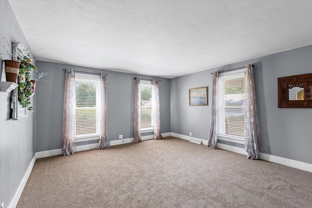835 E Pells St, Paxton, IL 60957 - unfurnished room featuring carpet and a textured ceiling