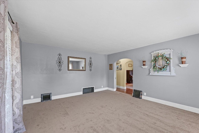 835 E Pells St, Paxton, IL 60957 - unfurnished room with arched walkways and carpet flooring