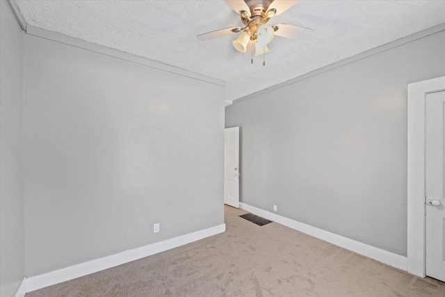 835 E Pells St, Paxton, IL 60957 - empty room featuring carpet, a textured ceiling, and ceiling fan