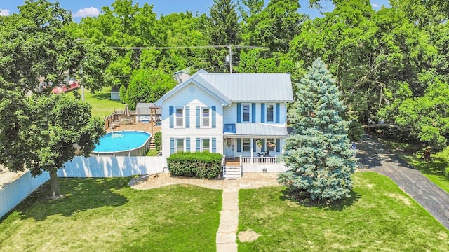 835 E Pells St, Paxton, IL 60957 - view of front of property featuring covered porch, an outdoor pool, and a metal roof