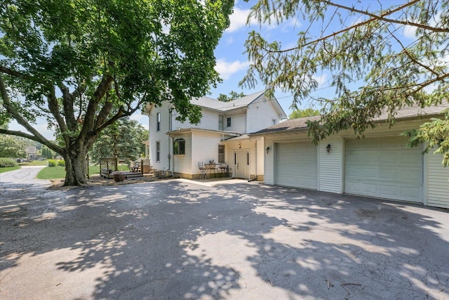 835 E Pells St, Paxton, IL 60957 - view of front of property featuring asphalt driveway and an attached garage