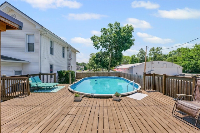 835 E Pells St, Paxton, IL 60957 - view of swimming pool with a wooden deck and a fenced backyard