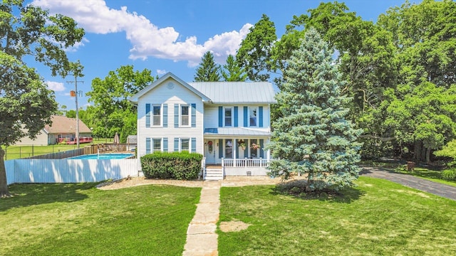 835 E Pells St, Paxton, IL 60957 - traditional home featuring a porch and a metal roof