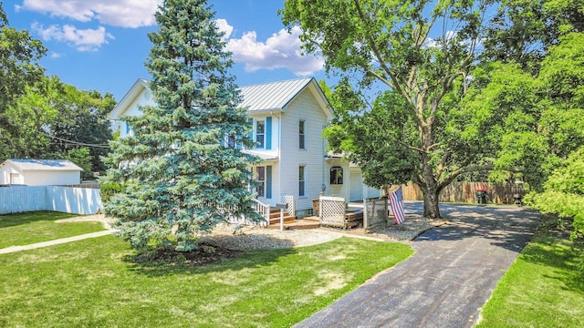 835 E Pells St, Paxton, IL 60957 - view of front of home with asphalt driveway and a metal roof