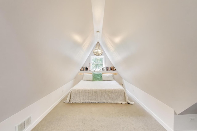 653 Blackstone Pl, Highland Park, IL 60035 - carpeted bedroom with lofted ceiling and baseboards