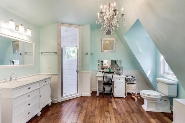 653 Blackstone Pl, Highland Park, IL 60035 - full bath featuring vanity, a stall shower, healthy amount of natural light, wood finished floors, and wainscoting