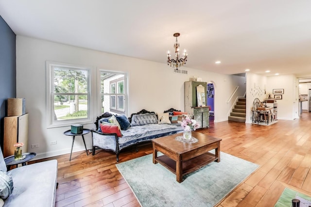 653 Blackstone Pl, Highland Park, IL 60035 - living area featuring stairs, light wood-type flooring, a chandelier, and recessed lighting