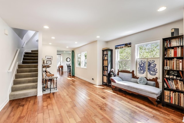 653 Blackstone Pl, Highland Park, IL 60035 - sitting room with stairs, healthy amount of natural light, light wood-type flooring, and recessed lighting