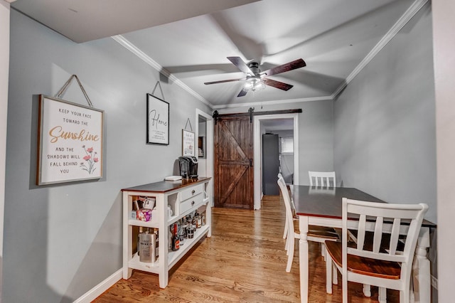 9116 S 53rd Ct, Oak Lawn, IL 60453 - dining area featuring a barn door, light wood-type flooring, ceiling fan, and crown molding