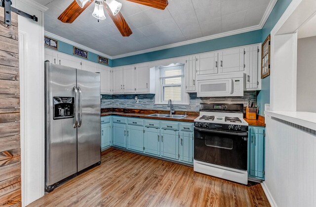 9116 S 53rd Ct, Oak Lawn, IL 60453 - kitchen with white appliances, blue cabinetry, ceiling fan, backsplash, and crown molding