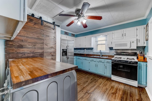 9116 S 53rd Ct, Oak Lawn, IL 60453 - kitchen with white appliances, wooden counters, blue cabinets, and ornamental molding