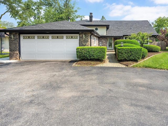 624 63rd St, Downers Grove, IL 60516 - view of front of home featuring driveway, brick siding, an attached garage, and a shingled roof