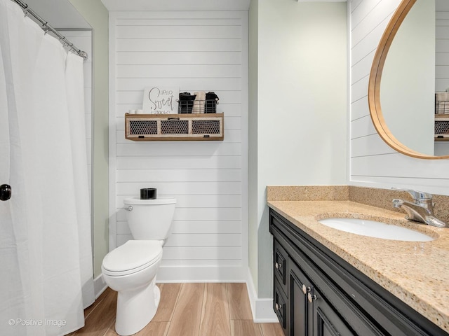 624 63rd St, Downers Grove, IL 60516 - bathroom with wood finished floors, vanity, and a shower with shower curtain