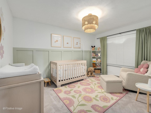 624 63rd St, Downers Grove, IL 60516 - carpeted bedroom with a nursery area, a wainscoted wall, and a decorative wall